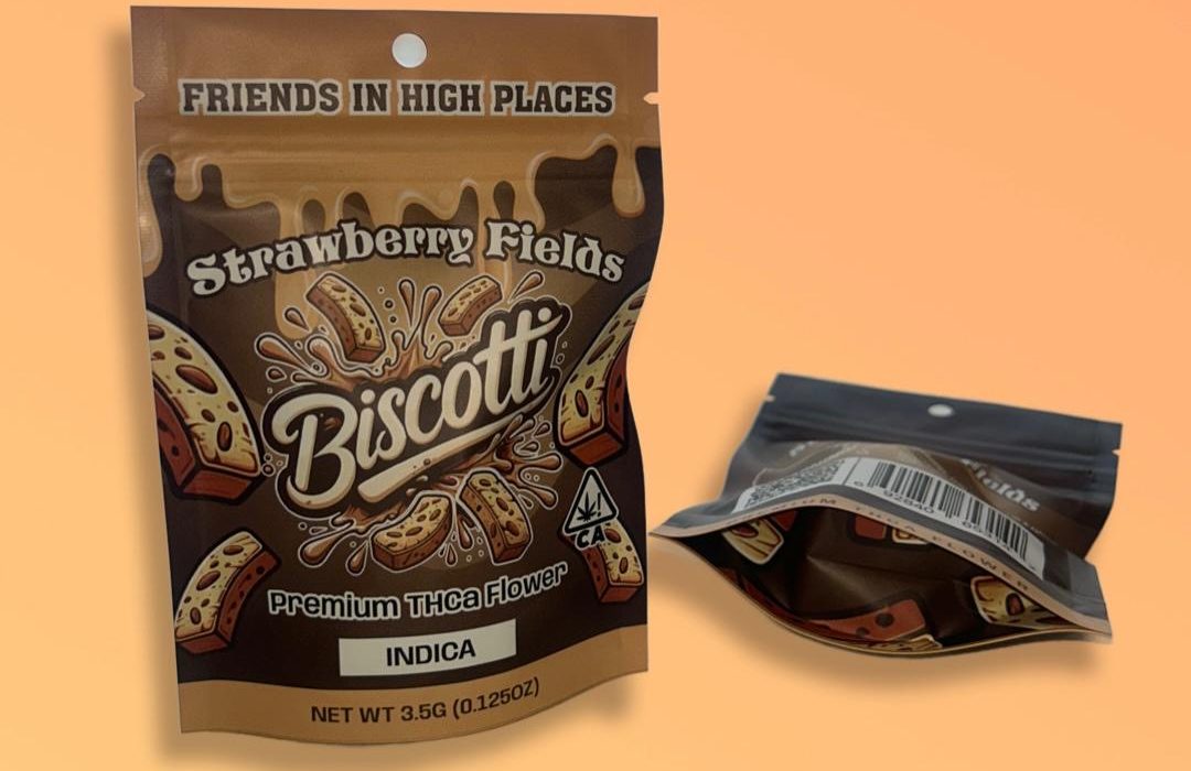 A package of Strawberry Fields biscotti premium THCa flower displayed on a yellow orange background.