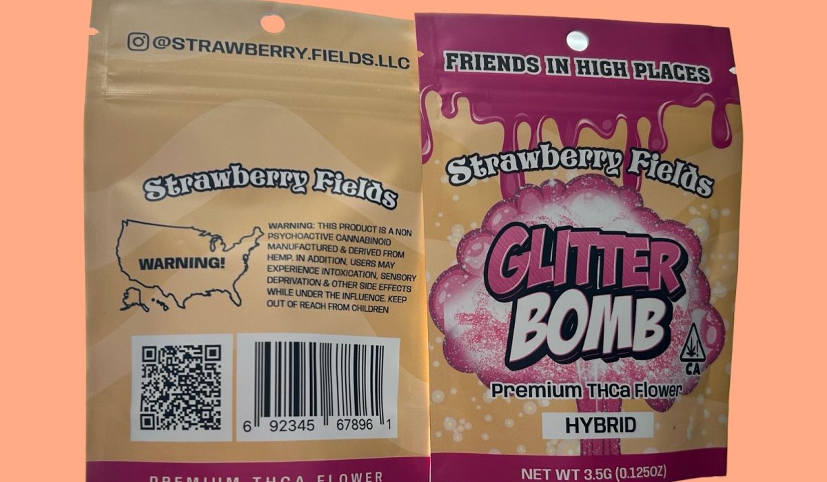 A package of Strawberry Fields glitter bomb premium THCa flower displayed on an orange background.