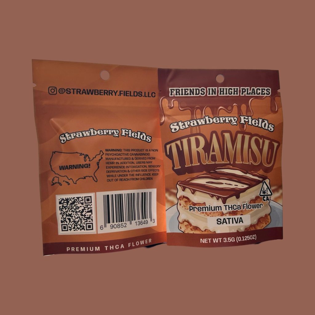 A package of Strawberry Fields tiramisu premium THCa flower displayed on a brown background.